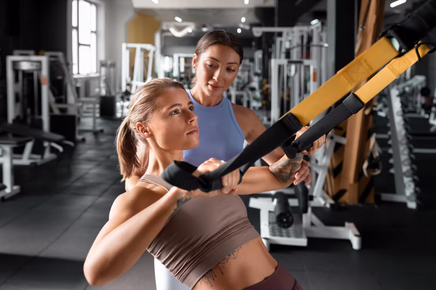 Athlete working with professional coach; reflects unseen effort, expert guidance, and elite wellness status.